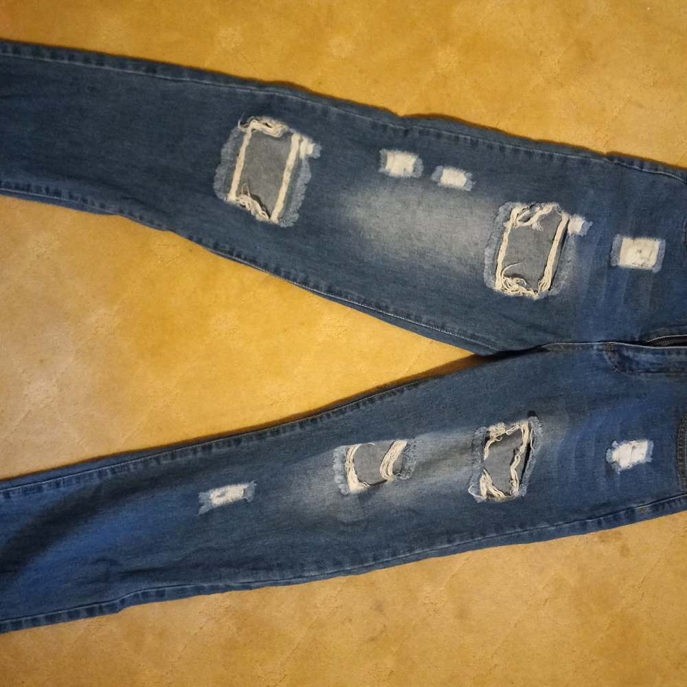 Ripped jeans. Dark and faded blue. Small.